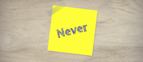 sticky note with "Never" as reminder for wording in college application essays