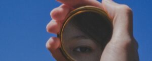 Student looking in mirror
