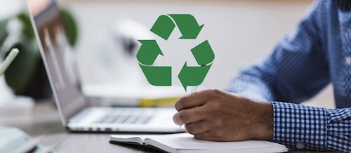 recycle symbol overlaid on photo of student writing